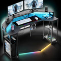 Gaming Desk with Power Outlets & LED Lights, 63" Wing-Shaped Computer Desk with Full Monitor Stand,Wireless Charging,Shelves,RGB Mouse Pad, Studio Desk Corner Desk with Headphone Hook (Black)
